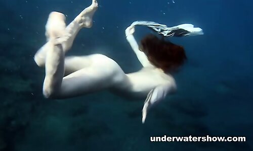 Nastya swimming nude in the sea