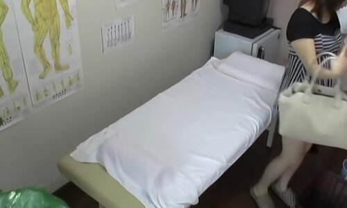 Japanese babe gets fingered during erotic massage session