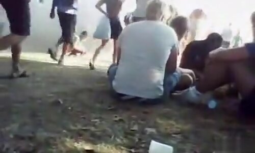 girls peeing in public at the music festival